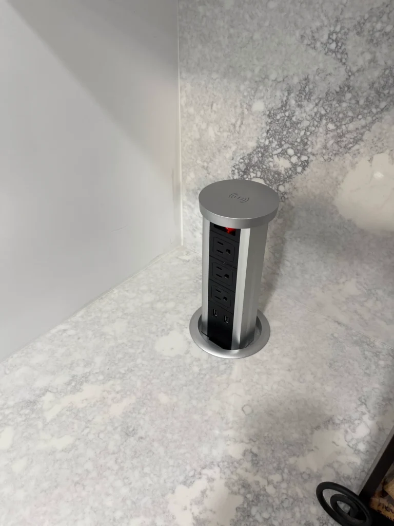 Pop-up outlet built into a quartz countertop