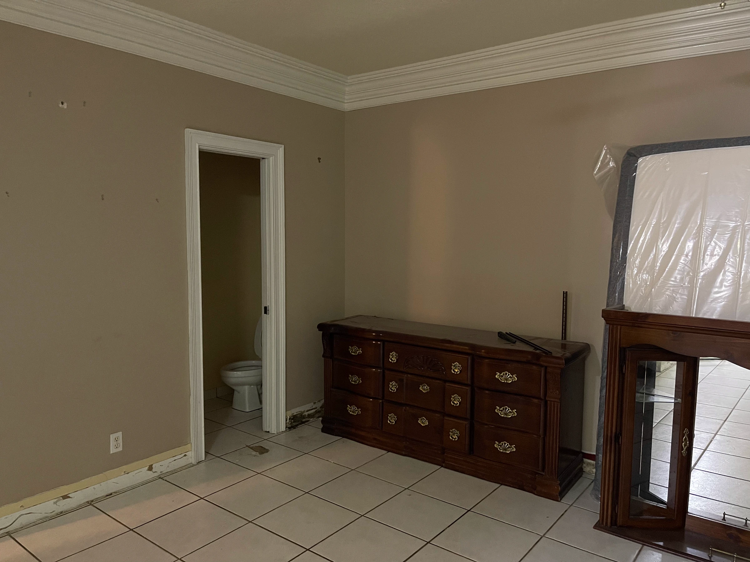 The same wall before the custom cabinetry