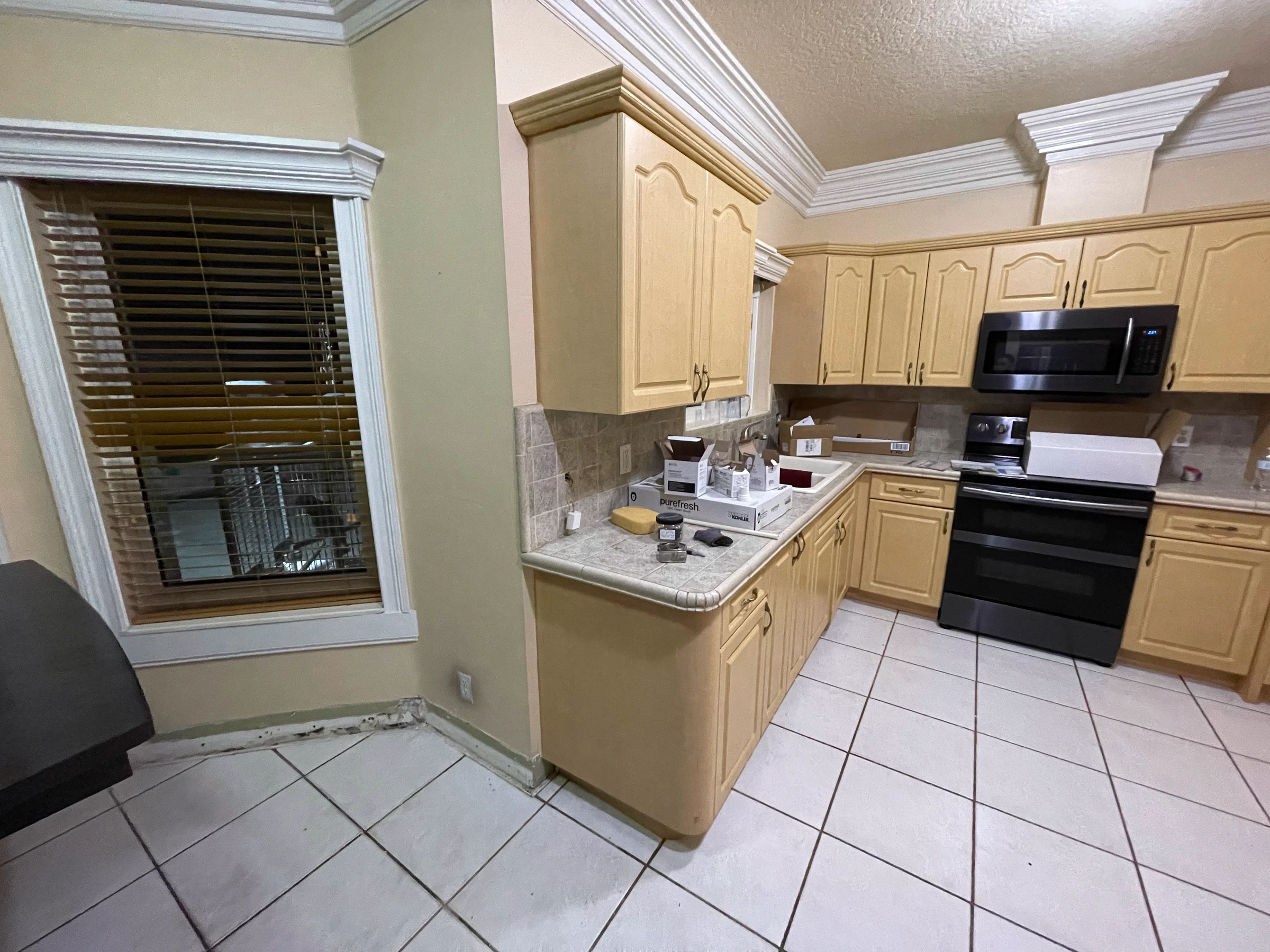 The same corner before the remodel, with light oak cabinets